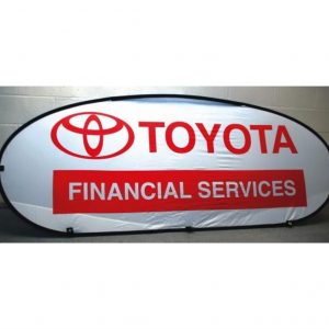 Red on white custom toyota banner in an oval black banner frame